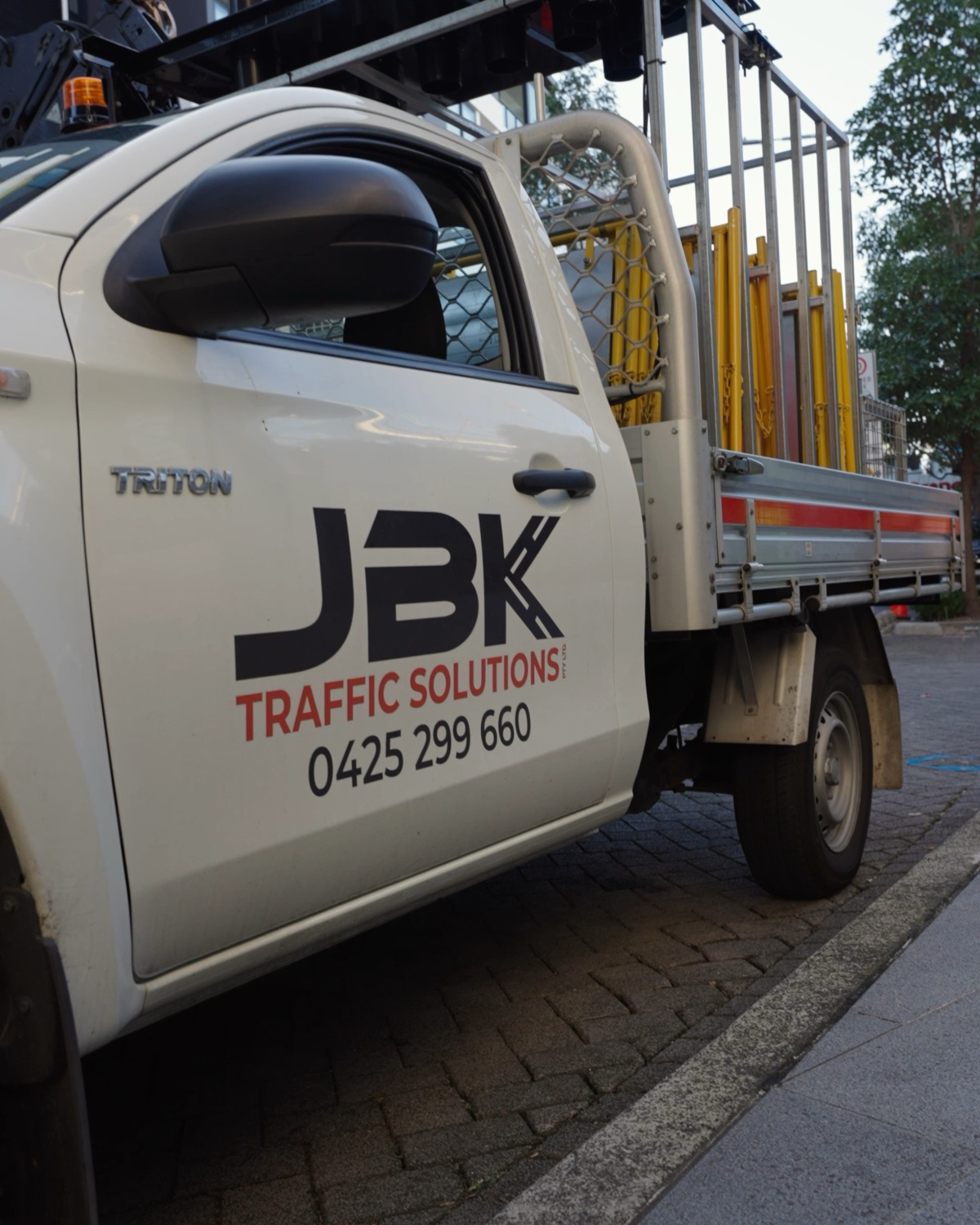 JBK Traffic Solutions signage ute with logo and phone number